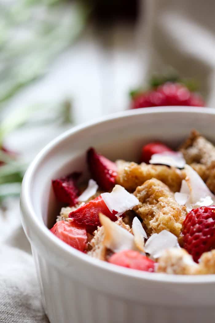 Strawberry Coconut French Toast Bakes for Two - So easy and yummy! And perfect for those lazy Saturdays and Sundays. Sprouted grain bread, fresh strawberries, and coconut flakes. Share with a friend or significant other! | rootsandradishes.com