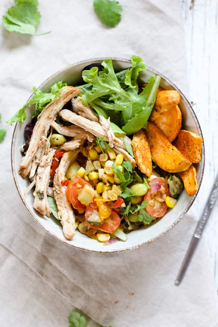 Summery Pulled Pork and Veggie Bowls - OMG these bowls embody summer at its finest! Smokey and spicy pulled pork, sautéed summer veggies, and roasted sweet potatoes, all combined in a big ol' bowl. So flavorful! | rootsandradishes.com