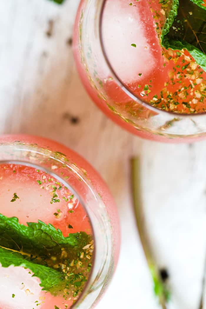 Watermelon ginger agua fresca in glass with fresh mint leaves