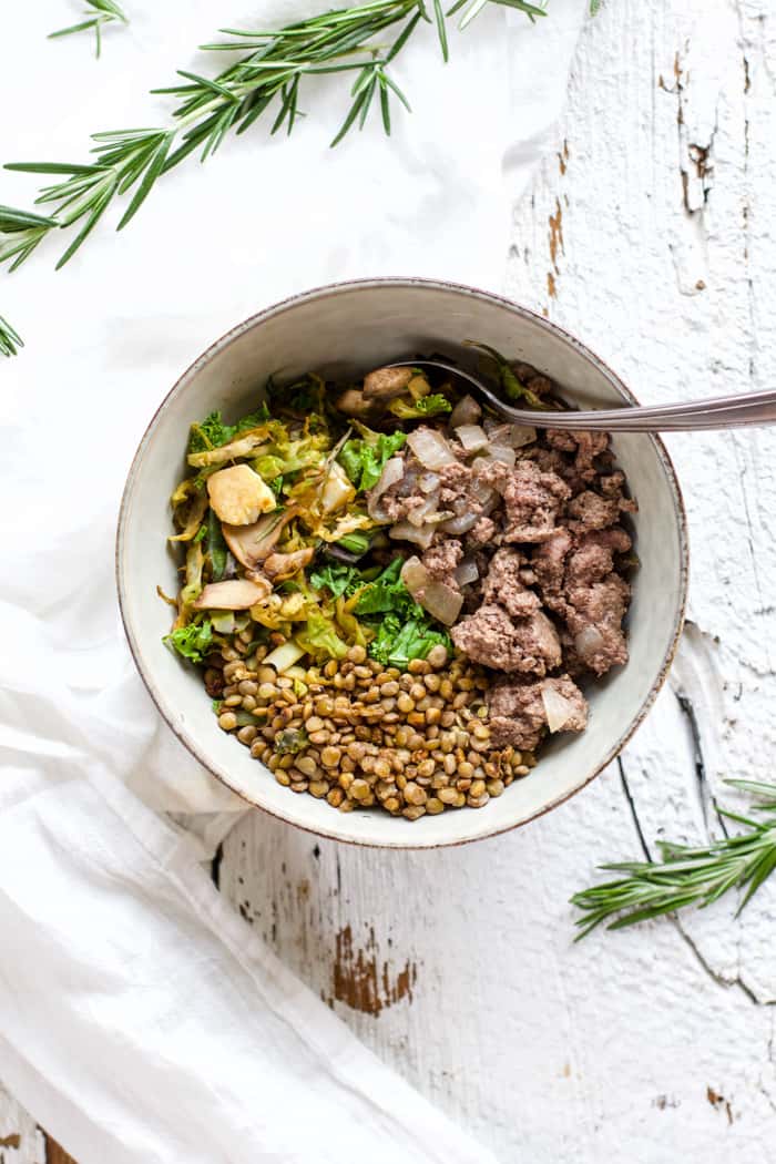 Bowl with rosemary oil beef and lentils