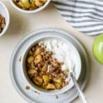 Apple pie yogurt bowl with spoon.
