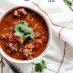 Bowl of classic beef chili with cilantro garnish