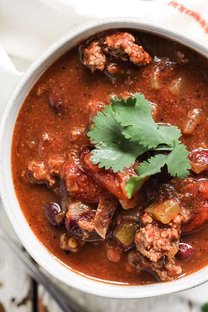 Bowl of classic beef chili with cilantro garnish