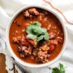 Bowl of classic beef chili with cilantro garnish