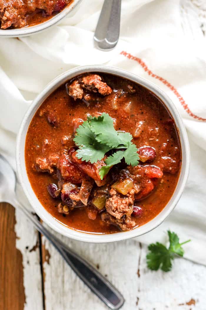 Bowl of classic beef chili with cilantro garnish