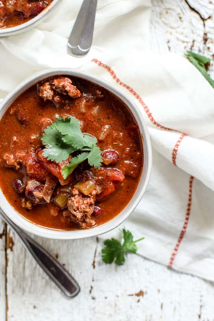 Bowl of classic beef chili with cilantro garnish