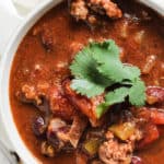 Bowl of classic beef chili with cilantro garnish