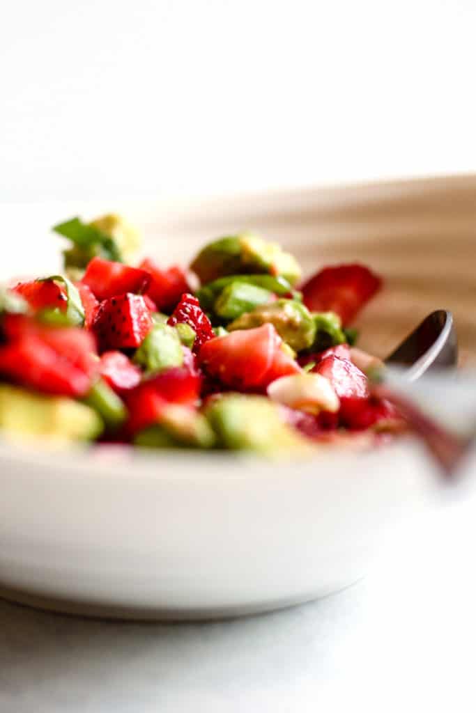 Strawberry avocado basil salsa in white serving dish