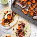 Sheet pan black bean tacos with carrots and lime