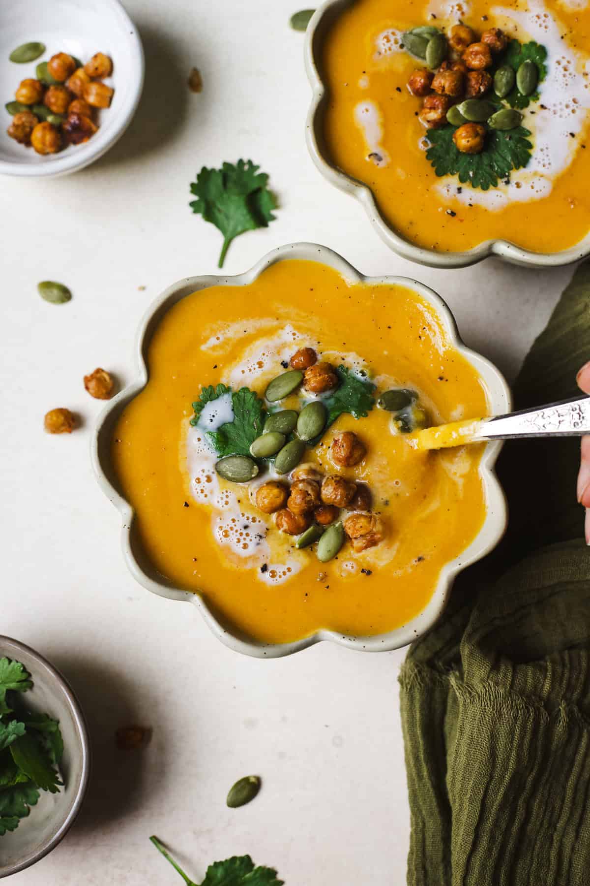 Thai butternut squash soup in a bowl with toppings.