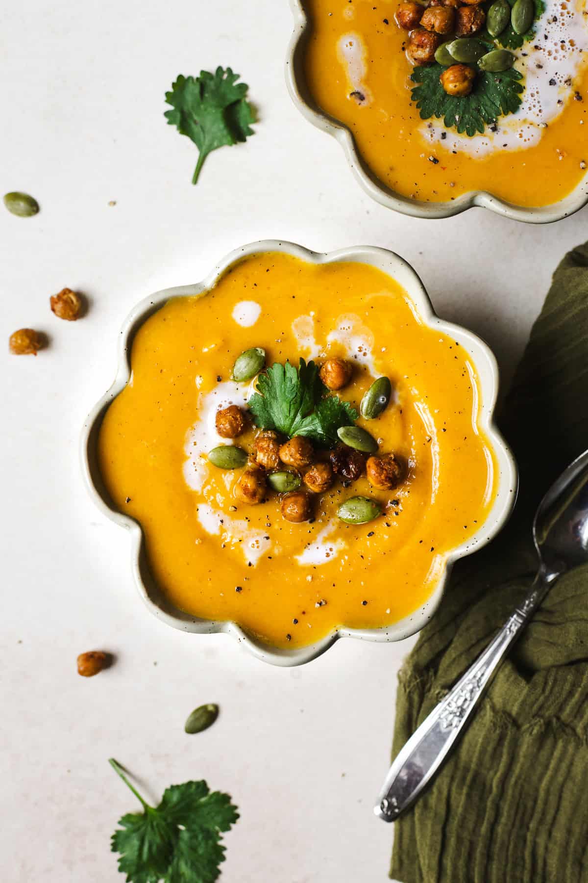 Thai butternut squash soup in a bowl with toppings.