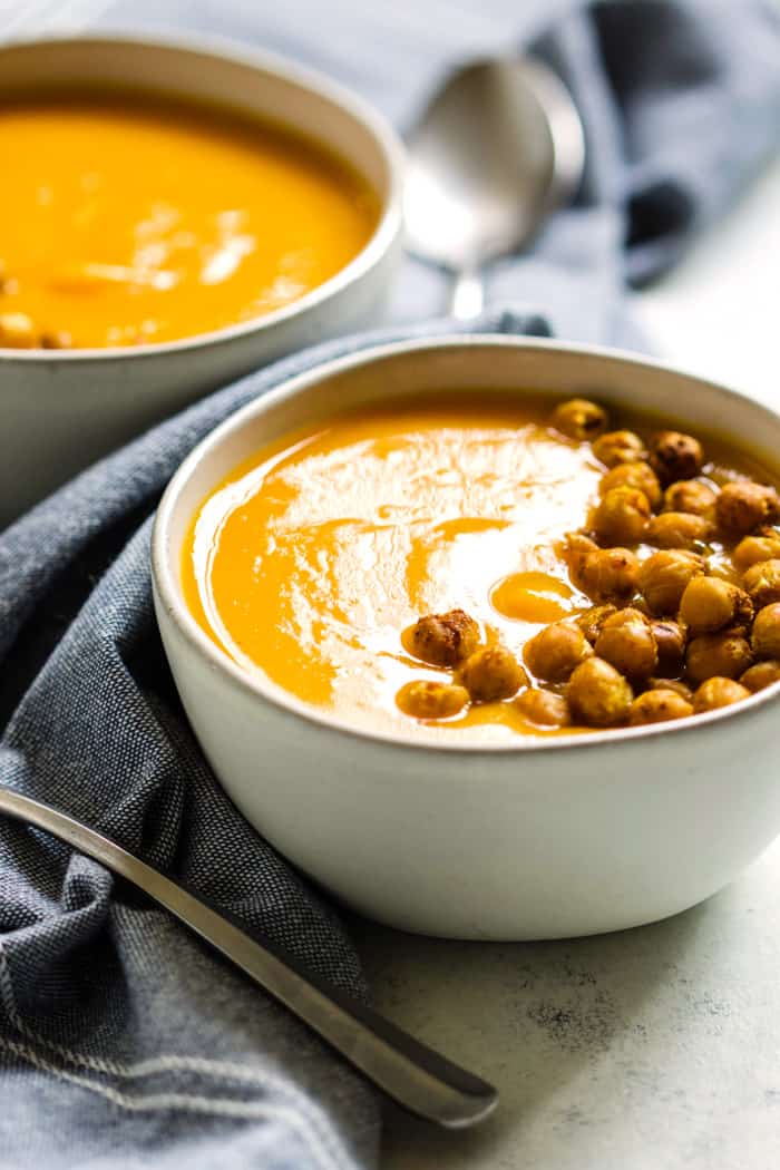 Bowl of thai-spiced butternut bisque with curry roasted chickpeas