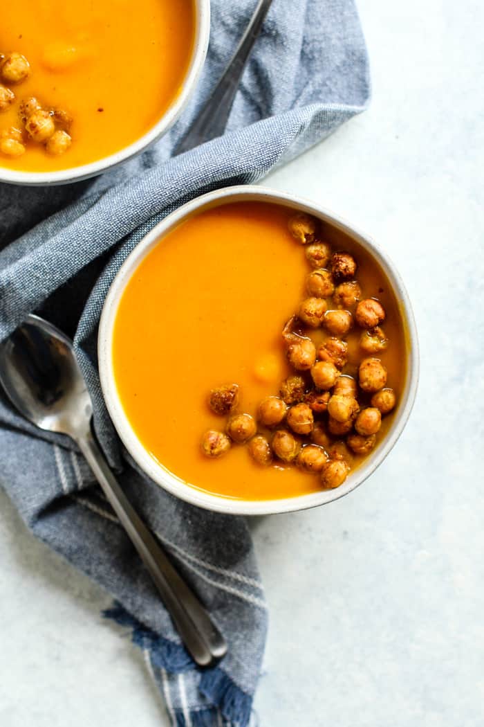 Bowl of thai-spiced butternut bisque with curry roasted chickpeas