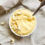 Creamy Cashew Butternut Sauce - Only 4 ingredients! Just cashews, broth, butternut squash, and garlic. Blend it all up for a delicious and creamy sauce that goes great on pasta, veggies, meat -- everything! Make a batch right now for cozy pasta dinners for the week ahead :) | rootsandradishes.com