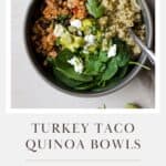 Turkey taco quinoa bowl with toppings and a fork.