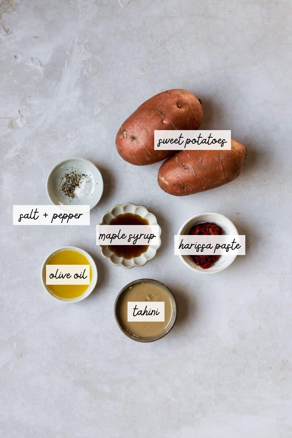 Ingredients needed to make harissa roasted sweet potatoes.