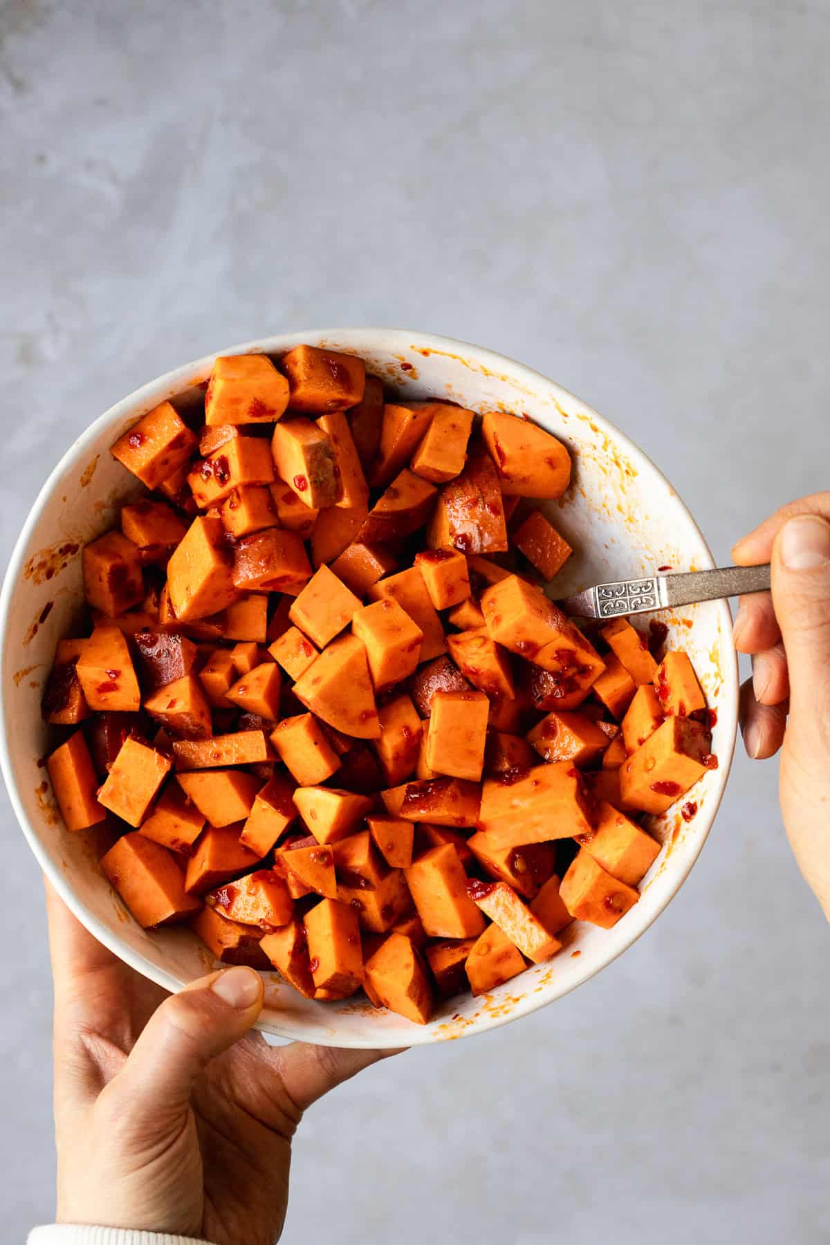 Sweet potato cubes seasoned with harissa paste.