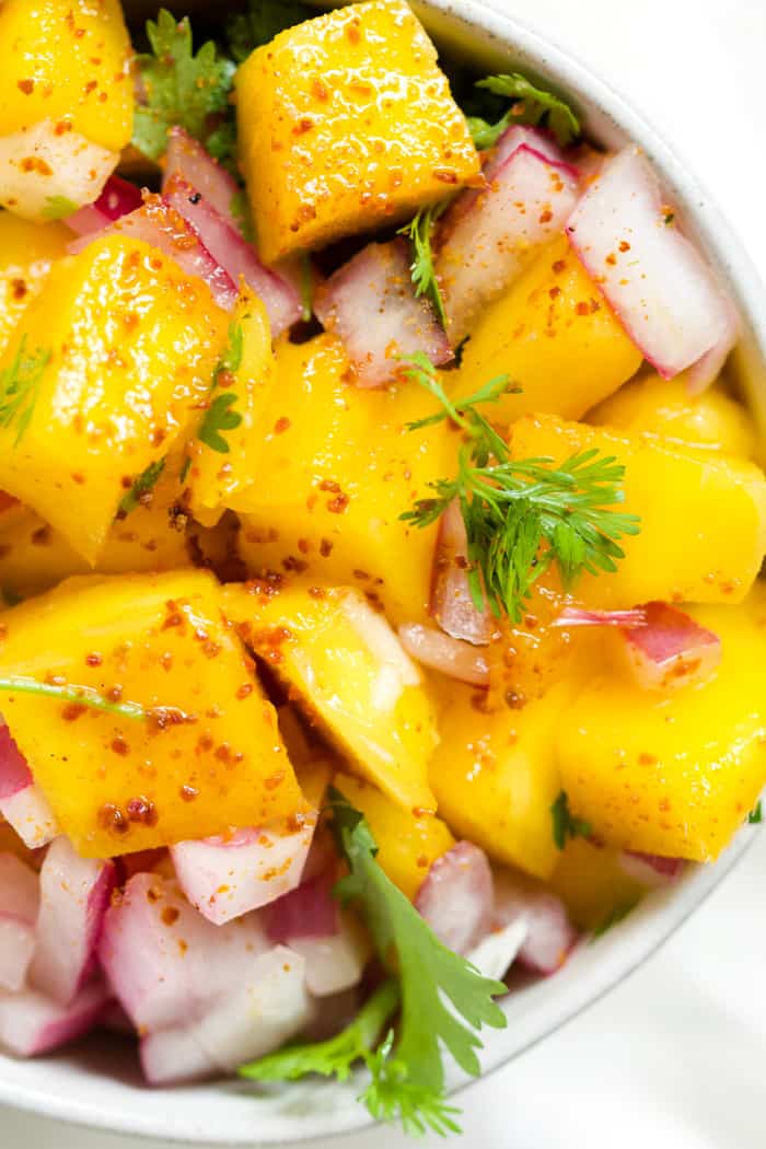 Mango salsa in small bowl.