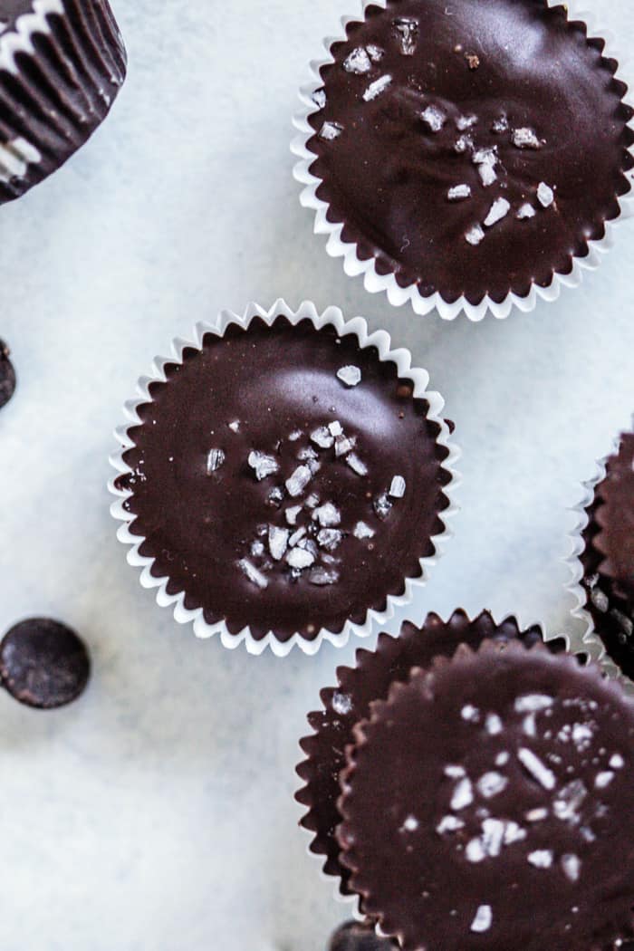 Scattered salted dark chocolate pumpkin peanut butter cups