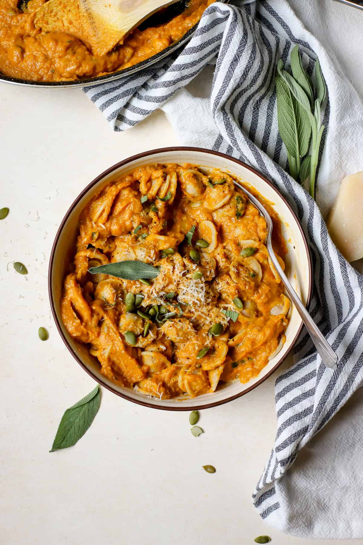 Creamy pumpkin pasta in bowl.