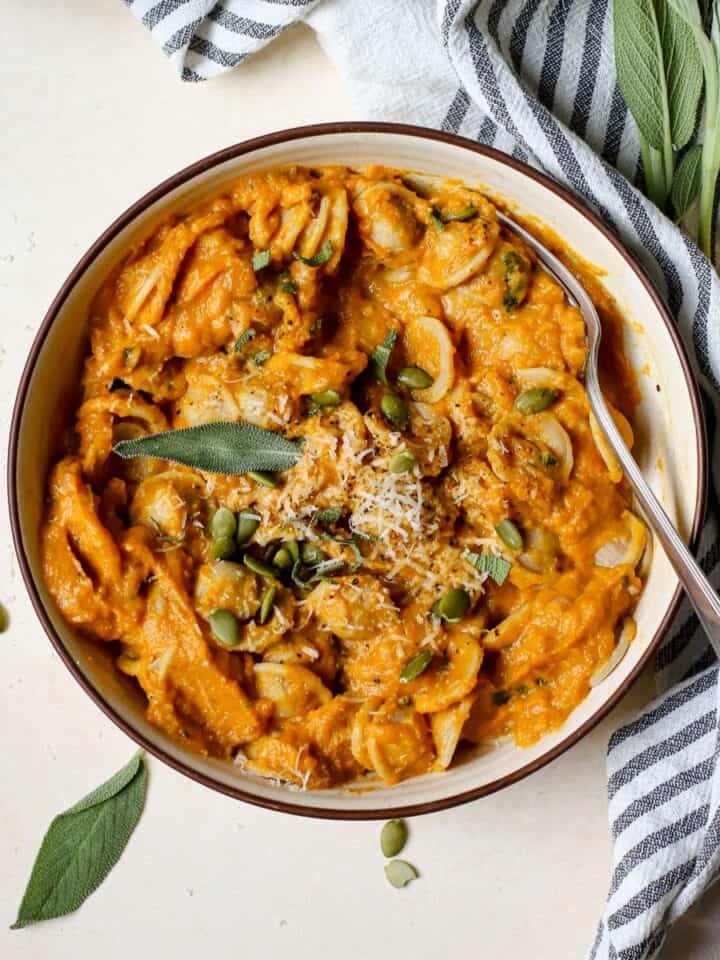 Homemade pumpkin pasta in bowl.