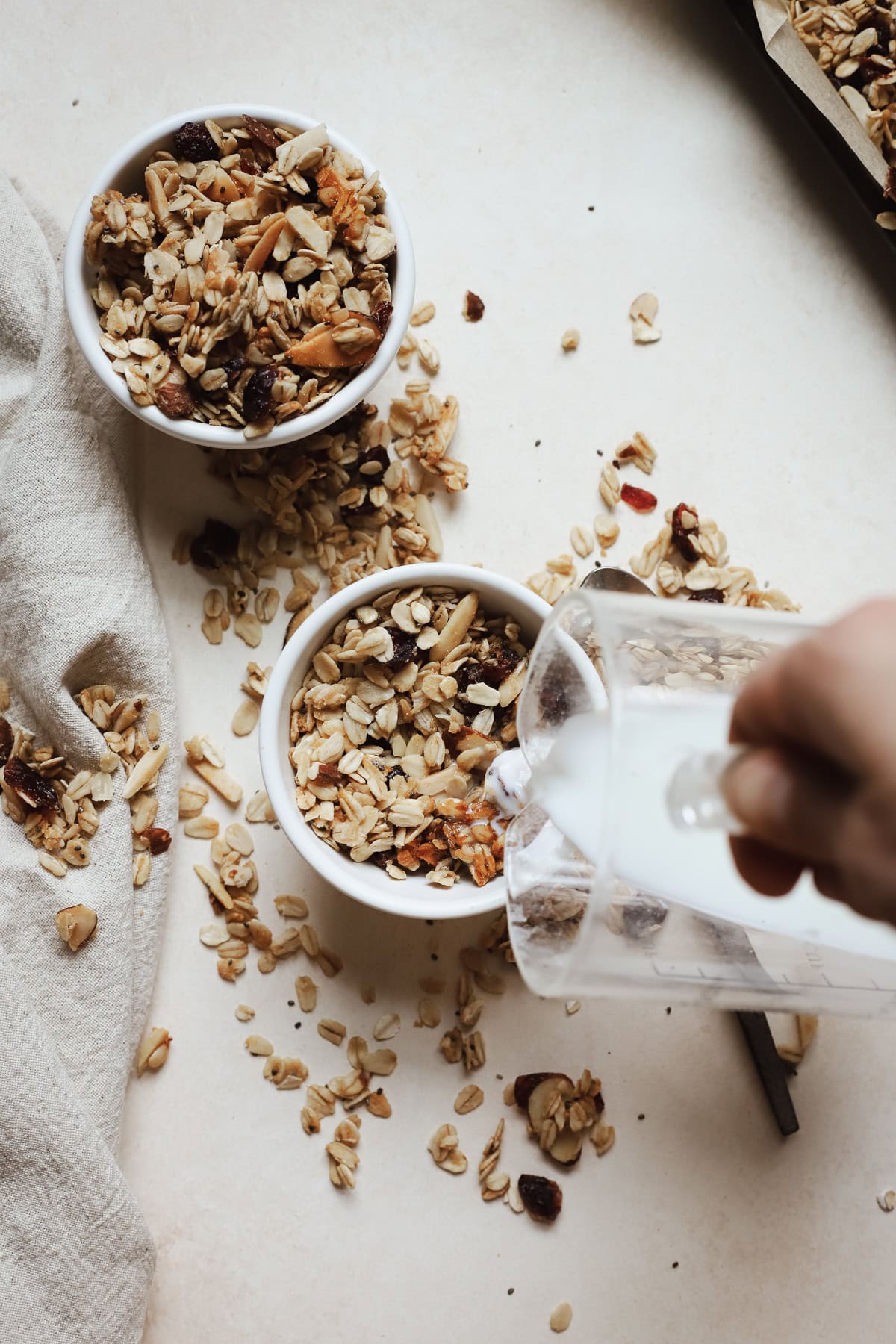 Pour milk into bowl of cranberry almond granola.