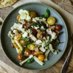 Tuna and olive tapenade pasta salad on a plate.