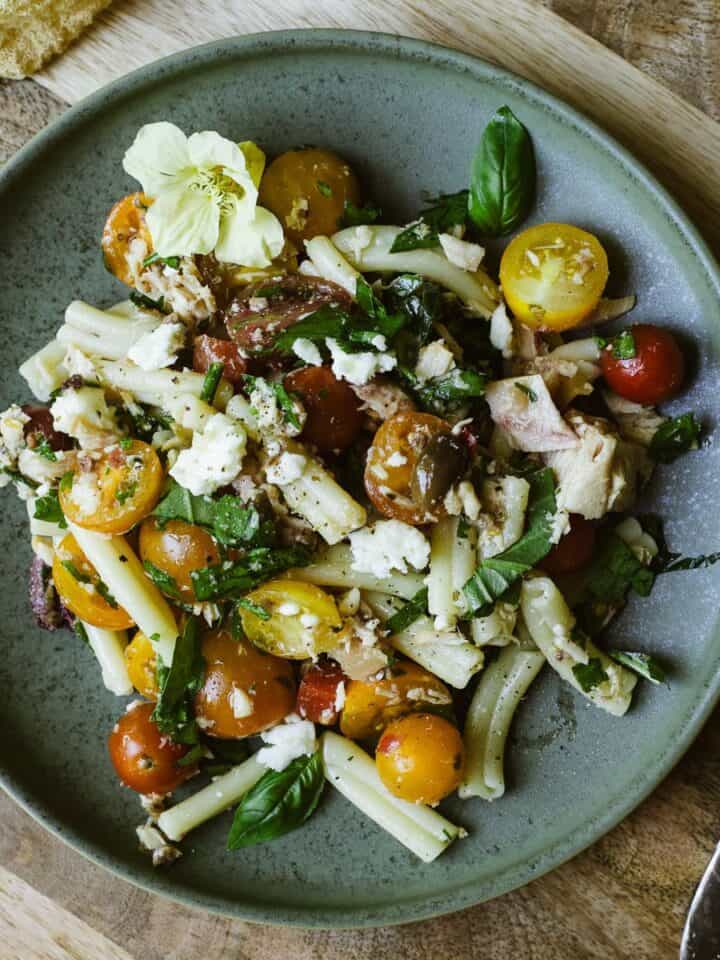Tuna and olive tapenade pasta salad on a plate.