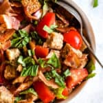 BLT panzanella in white bowl