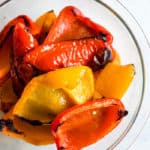 Roasted bell peppers in glass bowl