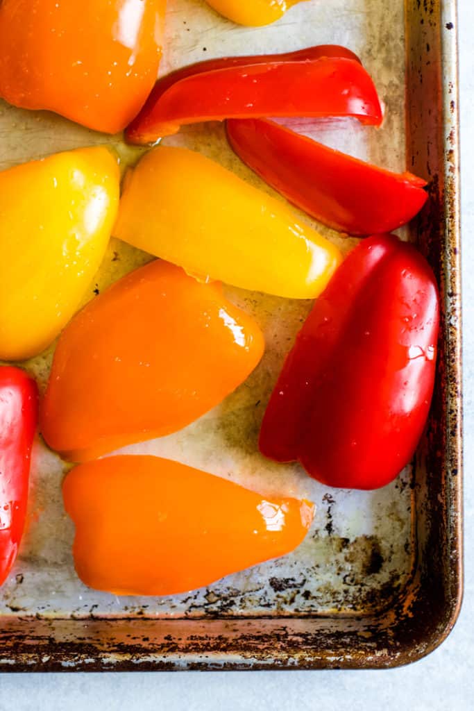 Bell peppers on sheet pan prior to roasting.