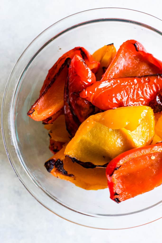 Roasted bell peppers in glass bowl