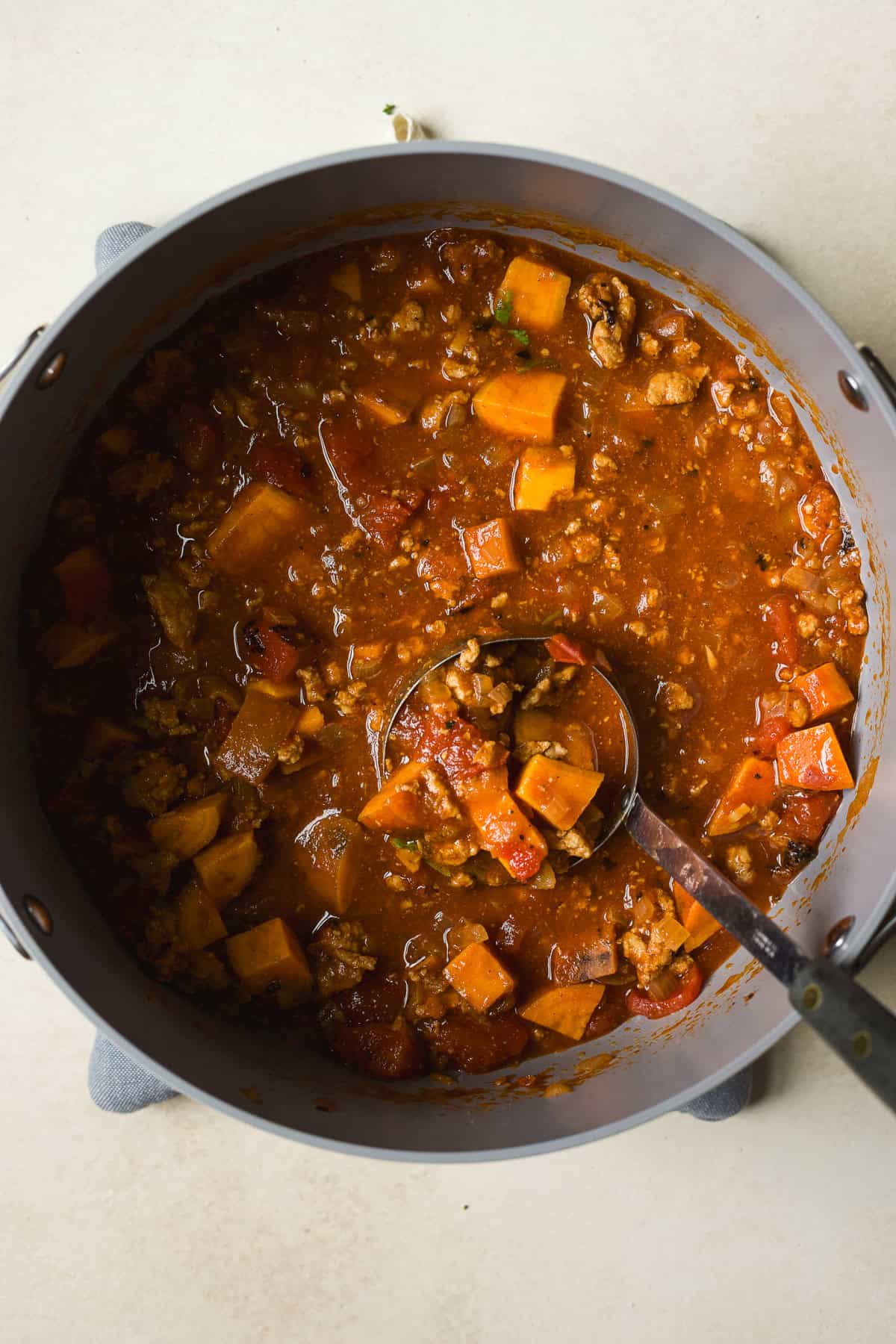 Large pot with sweet potato and turkey chili.