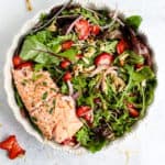 Strawberry salmon summer salad in white dish