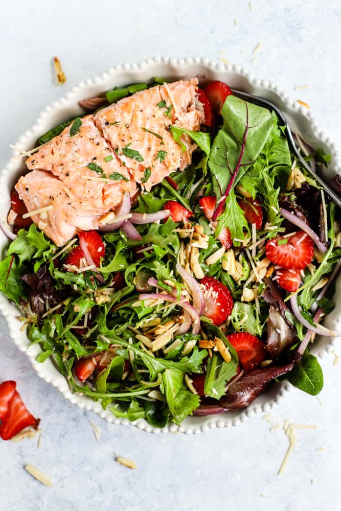 Strawberry salmon summer salad in white dish