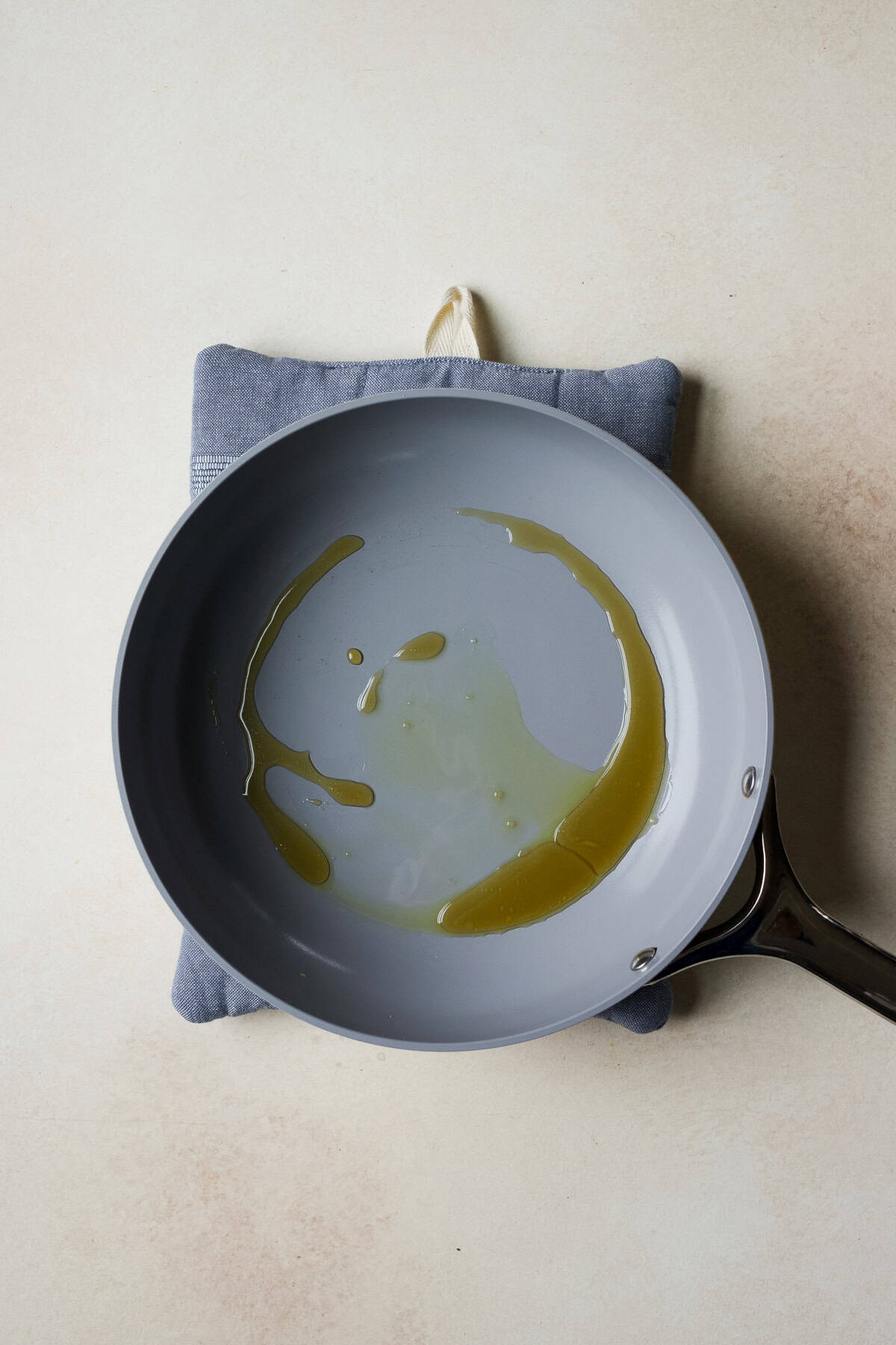 Heat olive oil and maple syrup over medium heat.