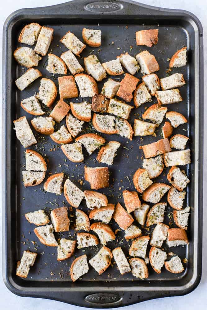 Seasoned bread cubes on sheet pan