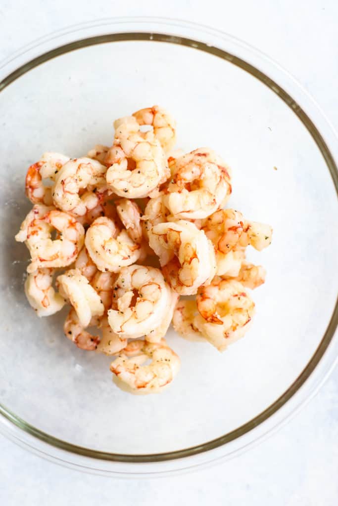 Cooked shrimp in clear glass bowl