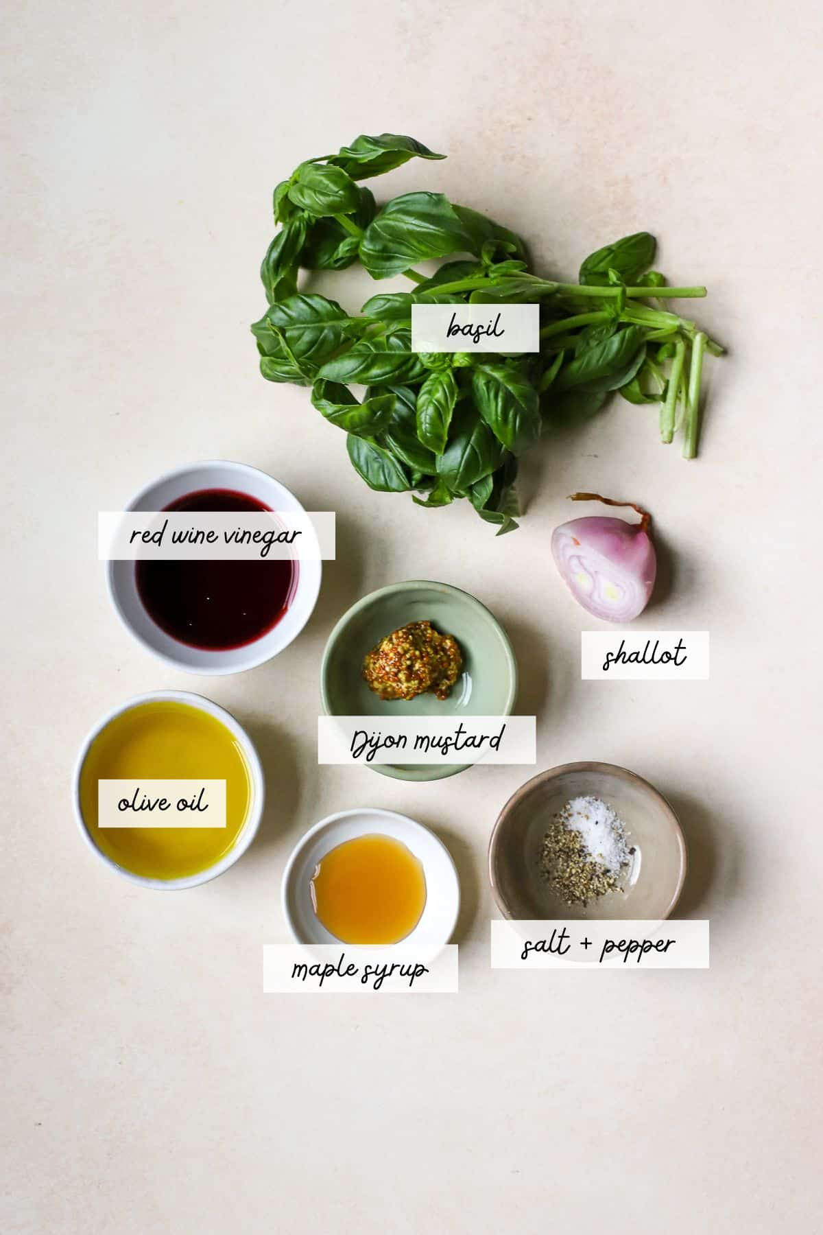 Fresh basil, red wine vinegar, olive oil, Dijon mustard, shallot, maple syrup, salt, and pepper.