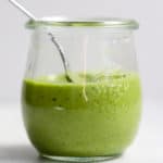 Homemade basil vinaigrette in small Weck jar with spoon