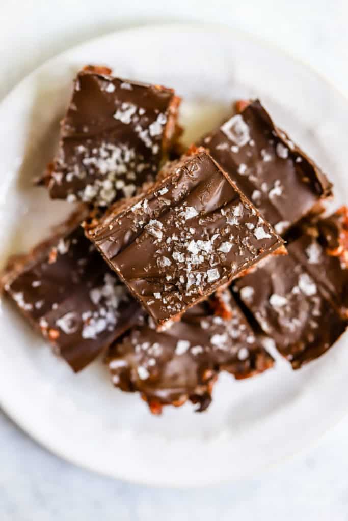 Healthy scotcheroos squares stacked on small white plate