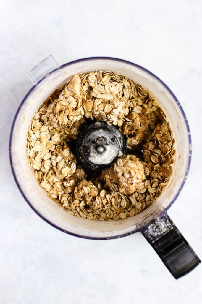 Health oatmeal cookie peach crisp topping in food processor after pulsing ingredients together