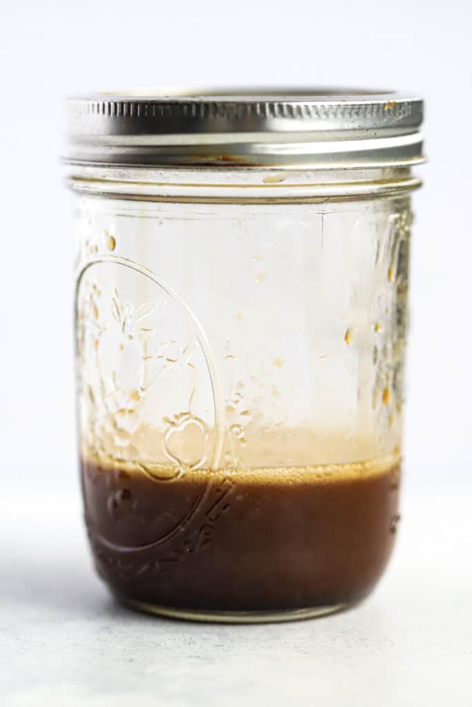 Sesame soy vinaigrette in mason jar with silver lid