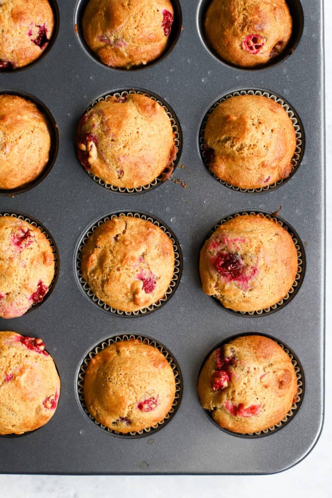 Healthy cranberry orange muffins in muffin tin