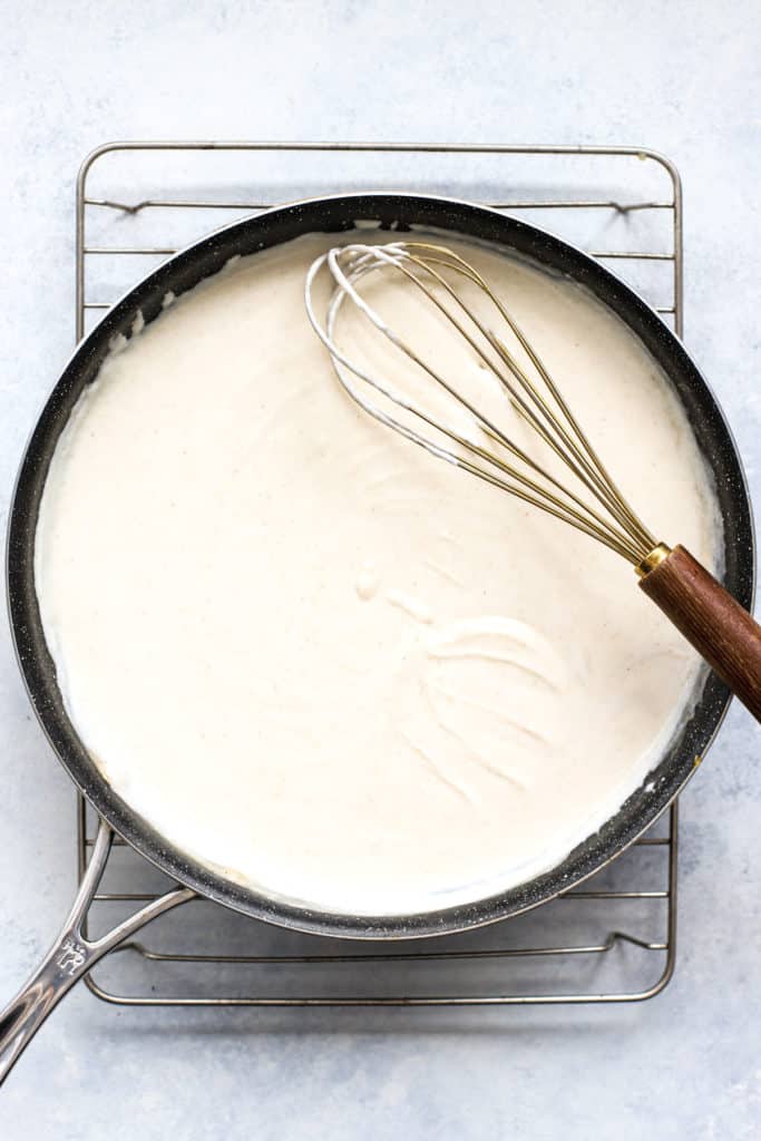 Thick and creamy white enchilada sauce in skillet.