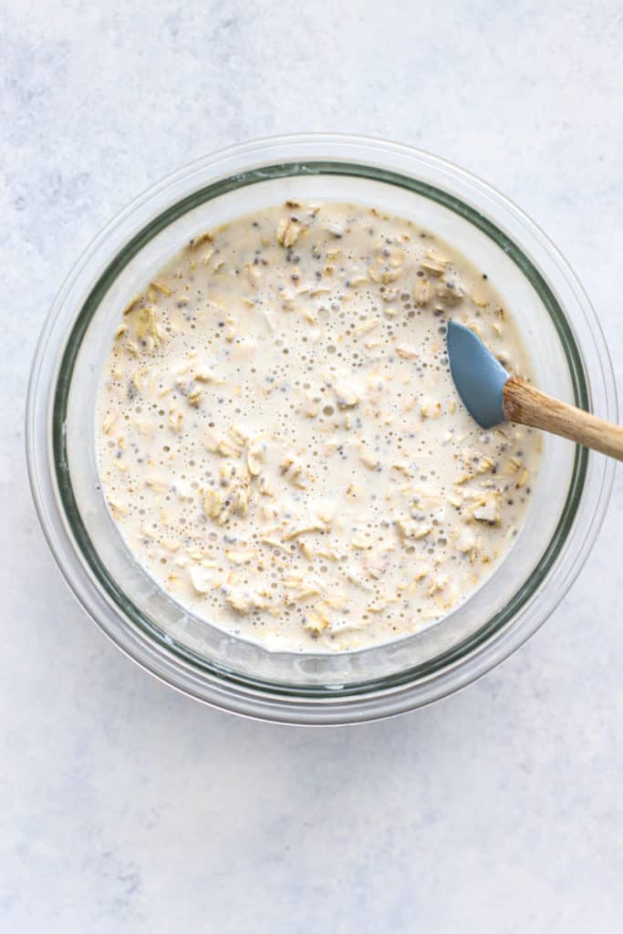 Overnight oats mixed together in clear glass bowl