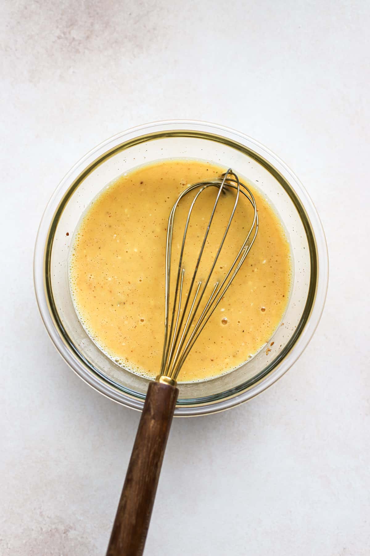 Eggs whisked with Greek yogurt, salt, pepper, and chile powder.