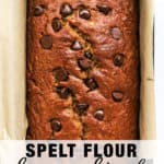 Spelt flour banana bread with chocolate chips in loaf pan lined with parchment paper