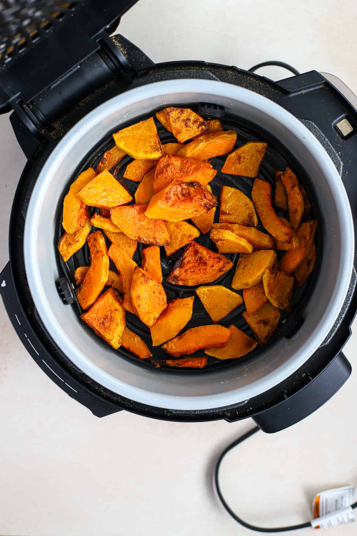 Air-fried butternut squash in air fryer.