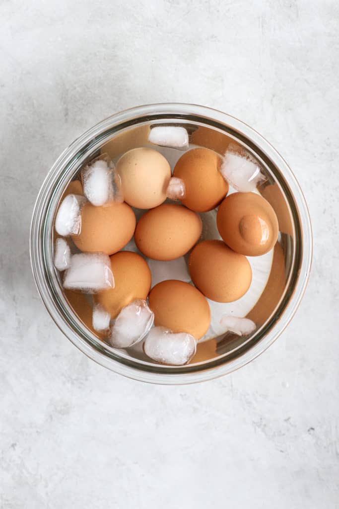 Boiled eggs in ice bath to stop cooking process.
